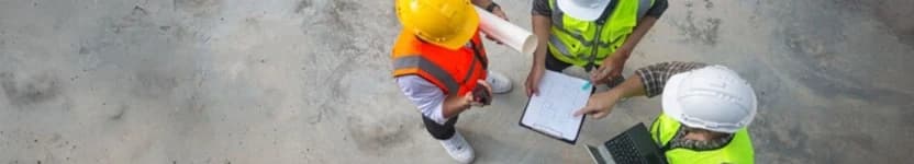 Surveyors discussing plans