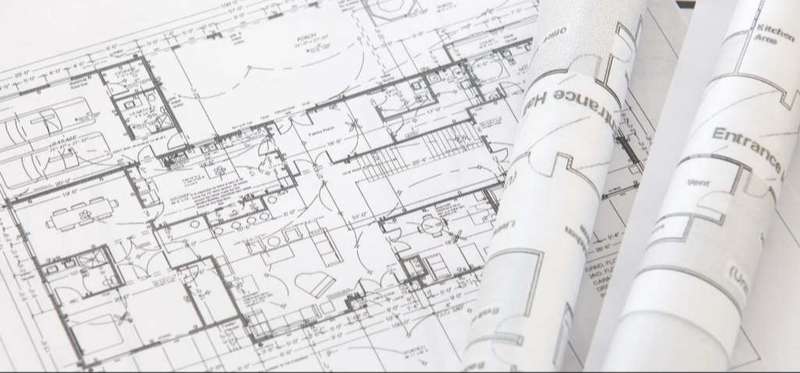 architect rolls and architectural plan, technical project drawing